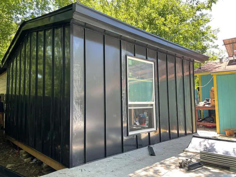 Black standing seam metal wall panels for Roof Inspection in Martin